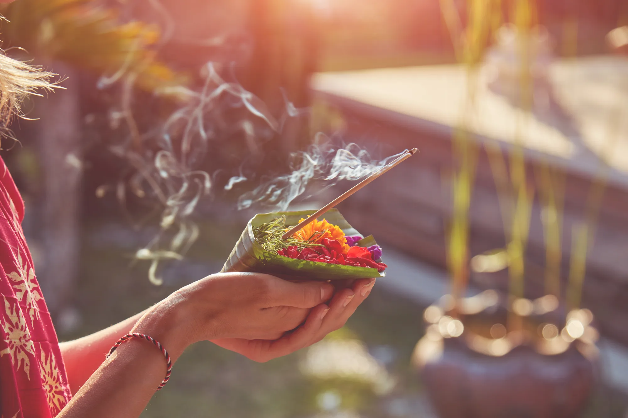 Incense smoke rising from a Balinese morning offering